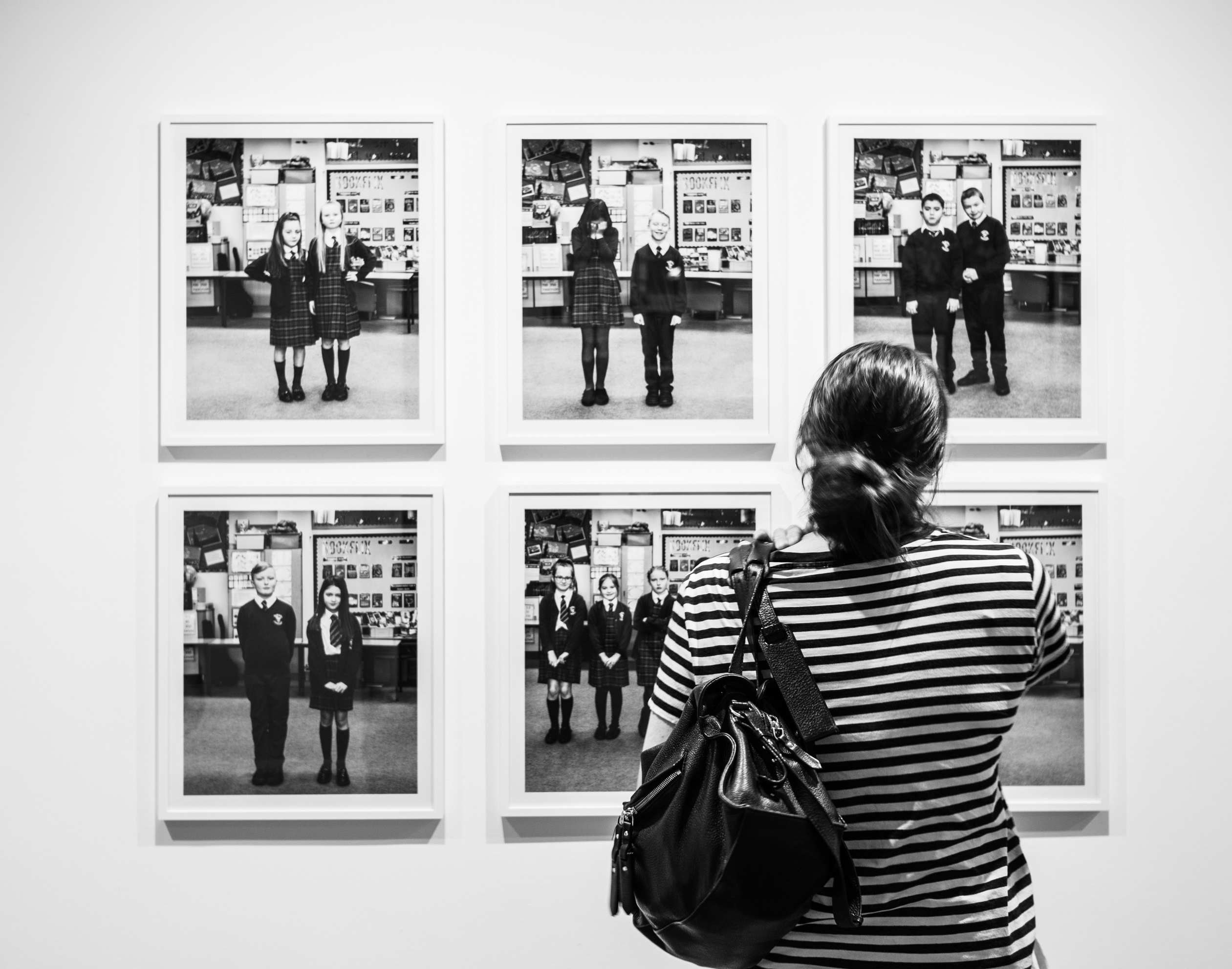 A gallery visitor views Youth Rising in the UK