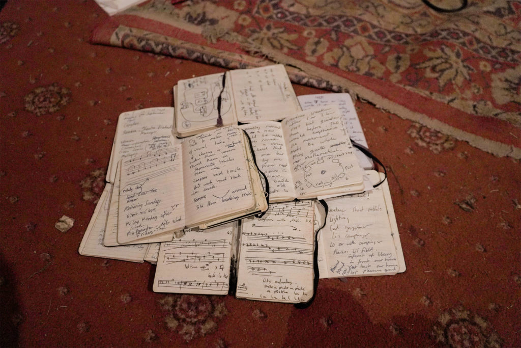 A pile of Moleskine notebooks